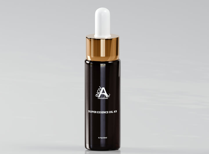 Luxury black glass dropper bottle of Inova Professional Super Essence Oil #3 with a glossy gold cap and white applicator. The label reads ‘Super Essence Oil #3, 0.7oz/20ml.’ The packaging has a sleek, high-end design, placed on a clean reflective surface